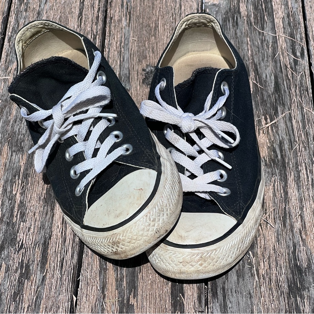 Women’s Converse All Star black low top sneakers. Double tongue top purple